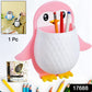 Side view of Penguin storage box holding remote control and electric toothbrush