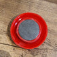 Arrangement of red magnetic buttons on a magnetic office board
