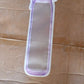Three bottle-shaped reusable food storage bags displayed together.