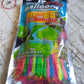 A stack of 111 multi-color Holi water balloons packaging.