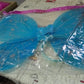 Detailed shot of the blue section of the fairy wings, showing glitter accents.