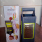 Easy-to-clean vegetable and fruit grater with cushioned grip, ready for washing.