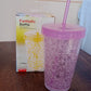 The durable plastic sipper tumbler displayed in natural light.