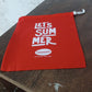 Clothes stored neatly inside a red drawstring bag, perfect for travel.