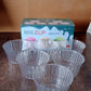 Clear plastic dessert bowls arranged for serving at parties