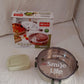 A different angle of the round Miracle Stainless Steel Lunch Box, highlighting its modern design.
