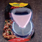 Stylish pink and brown ergonomic pizza cutter placed in kitchen setting