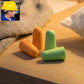 Reusable noise reduction foam ear plugs set on white background