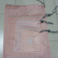 Folding nylon storage pouches for compact packing of various items.