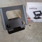 Compact size of the rotating laptop stand when folded, ideal for travel.