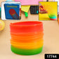 A child happily playing with the Rainbow Slinky Toy, demonstrating its fun movement.
