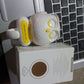 Packaging for the Indo Glow self adhesive bird wall hook, ready for delivery.
