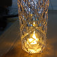 Detailed view of the transparent body and internal glitter of the Crystal LED Candle.