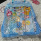 A child happily using the Kids Stationery Kit to draw and write at a desk, fostering creativity.