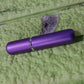 The 5ml portable refillable perfume bottle held comfortably in a hand.