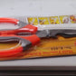 Multi-function kitchen scissors displayed with their packaging, ready for use in an Indian kitchen.