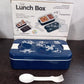 Dark blue airtight lunch box showcasing its sleek design and secure clasps.