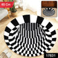 Close-up of 3D vortex checkered design on round floor mat