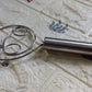 Dough whisk in action, mixing batter smoothly in a modern kitchen.