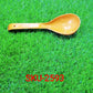 Simple yet elegant plastic serving spoon, showcasing its practical shape for serving various dishes.