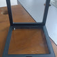 Transparent jewellery display box placed on retail counter near collections