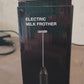 Alternative angle view of cordless electric milk frother with stainless steel whisk