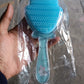 Packaging of the cartoon hair brush, emphasizing its suitability for children and ease of use.