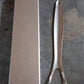 Packaging for the MintGuard stainless steel tongue scraper.