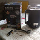 Dabster electric grinder surrounded by a vibrant selection of whole spices and coffee beans.