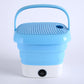 Mini folding washer on a clean background, highlighting its compact size for travel.