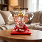 Detailed view of Ganesha idol showcasing intricate red and gold accents