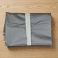Multiple breathable garment covers neatly organized in wardrobe