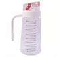 Clear 500ml glass oil dispenser with white handle and red auto-flip cap on white background