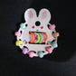 Young girl wearing pastel hairband from girls hair clip set