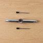 Compact multifunction spinner pen for stress relief and writing