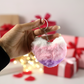 Soft plush heart keychain displayed on textured background