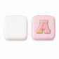 The LilyGleam travel jewellery box placed next to travel essentials like a passport and sunglasses.
