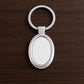 Sleek oval metal keychain showcasing durable build and chrome shine