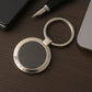 Durable round metal keychain with strong alloy build and black center.