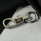 Close-up of premium metal carabiner keychain exhibiting fine craftsmanship