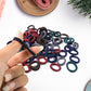 The full pack of 100 multicolour small hairbands, ready for versatile hair styling for girls.