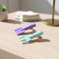 Display of colorful mini decorative hair clips with unique shapes