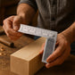 Close-up of metal try square with clear etched measurements on durable steel
