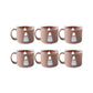 Tea cup set displayed on kitchen counter, ready for use