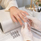 Variety of glitter press-on false nails featuring multiple colorful designs