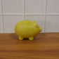 Children’s piggy money bank displayed in room