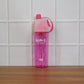 In use: pink sports water bottle with mist spray feature active