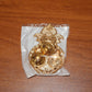 Decorative dual compartment kumkum holder with a golden finish for religious use