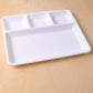 Empty 4-section plastic tray ready for meal preparation or serving.