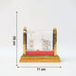 Detailed silver-plated devotional Kamdhenu cow idol with golden display frame